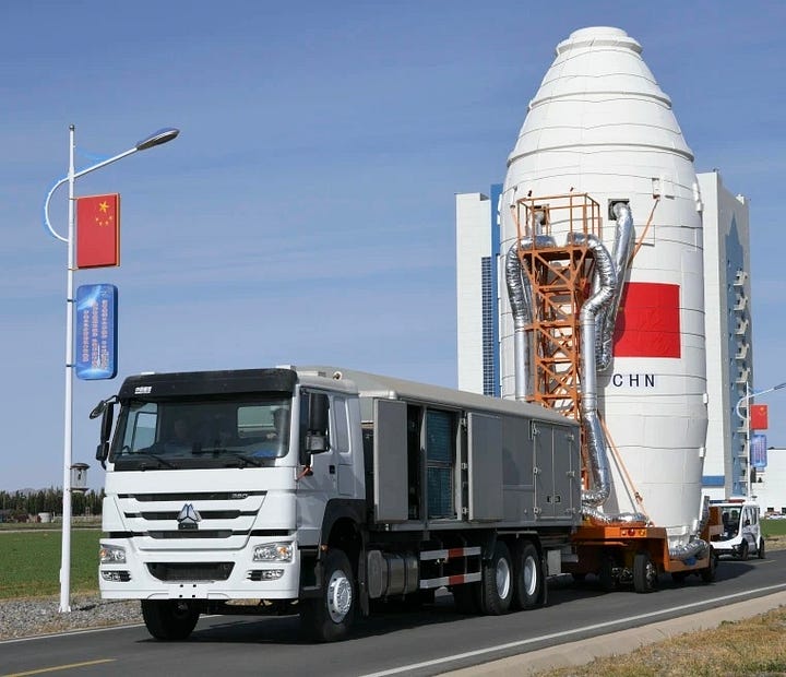 The first-stage and fairing for the Long March 2D Y92 vehicle heading to the launch pad.