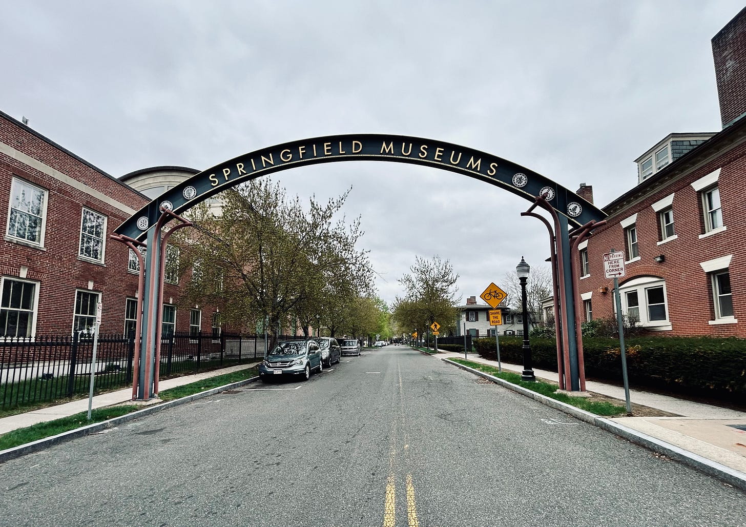 arch, road, street, car, building, sky, clouds arch, road, street, car, building, sky, clouds
