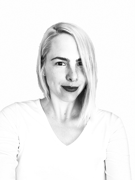 Danielle drinking a vinho verde in Lisboa, Portugal. Black white heaadshot of Danielle Blum. Two elephants in Tanzania. A little boy in Namibia. Canoe in Botswana. A woman with a basket on her head in Uganda. A baby seal in Nambia. The Sierra Mountains in Nevada. A rusted can in Cambodia