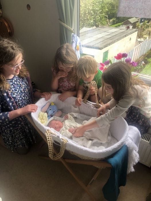 May be an image of 3 people and baby