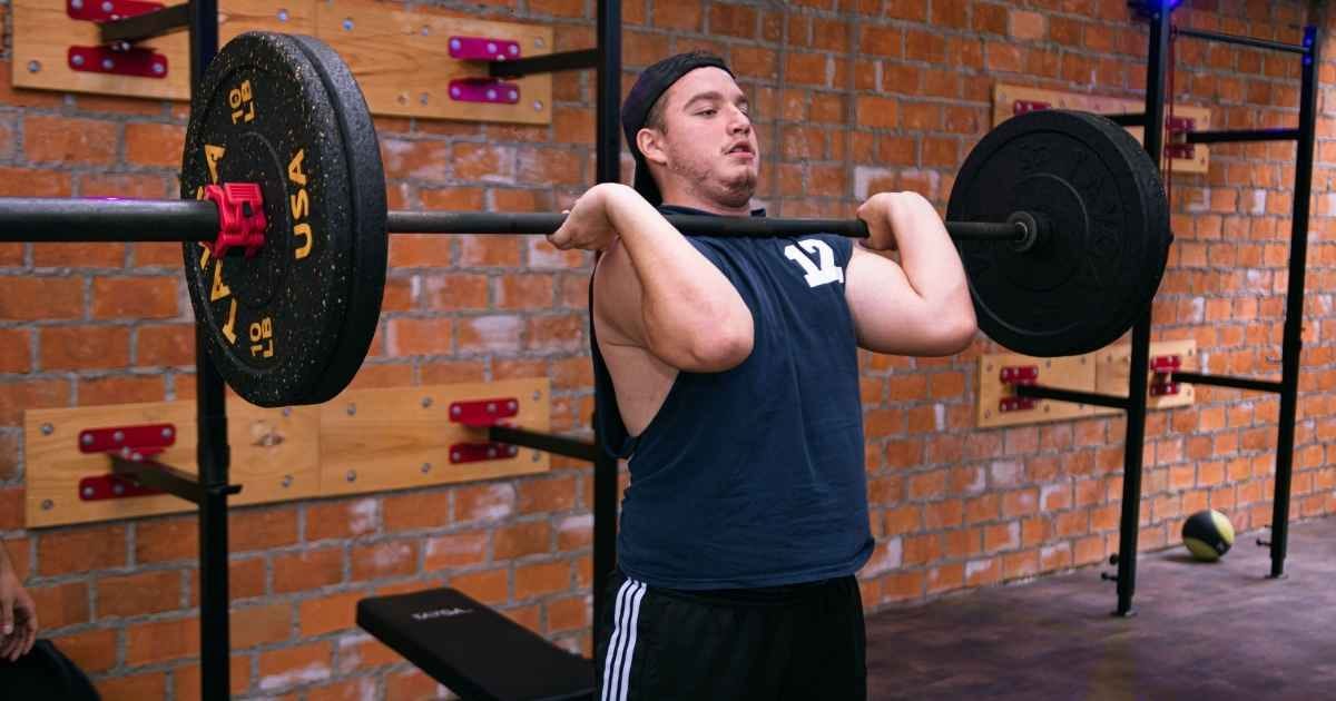 A man focuses on lifting a heavy barbell in a Ciudad de México gym A man focuses on lifting a heavy barbell in a Ciudad de México gym