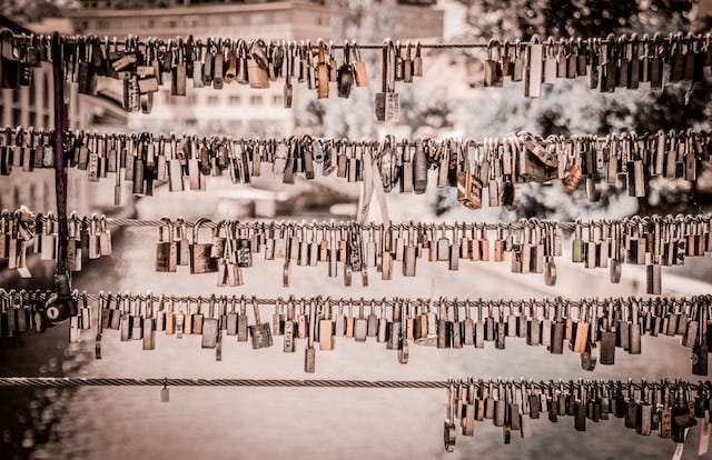 An image of many locks on a wire fence alongside a bridge. Intended as a metaphor for cloud security. An image of many locks on a wire fence alongside a bridge. Intended as a metaphor for cloud security.
