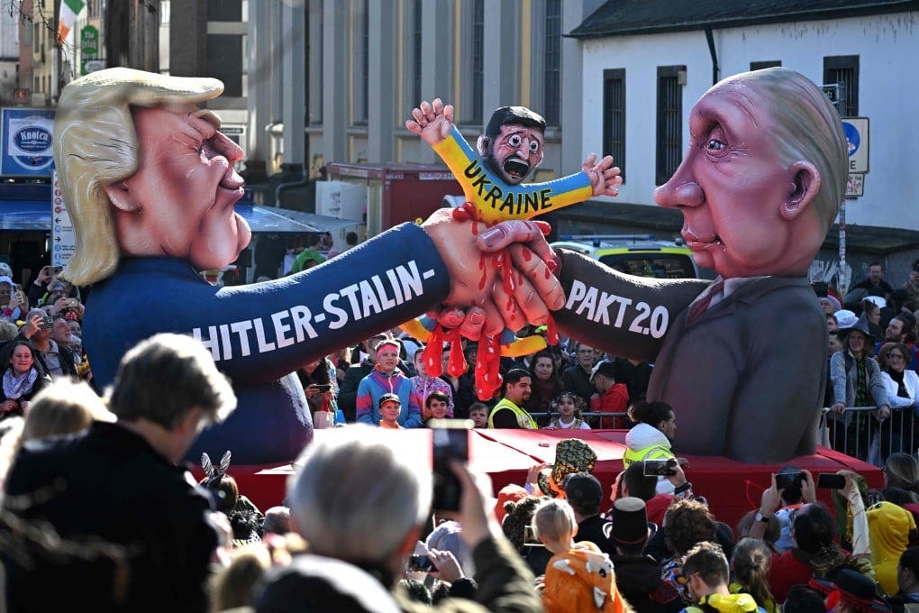 A float portraying Russian President Vladimir Putin, right, and US President Donald Trump forming a “Hitler-Stalin-Pact 2.0” to squash Ukraine and its President Volodymyr Zelensky, during the parade to celebrate Rose Monday in Duesseldorf, Germany on Monday. Photo: AFP