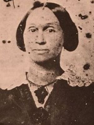 Photo from mid 1800s of a woman with dark hair wearing a dark dress. She could possibly have African or indigenous American ancestry, based on her features. Photo from mid 1800s of a woman with dark hair wearing a dark dress. She could possibly have African or indigenous American ancestry, based on her features.