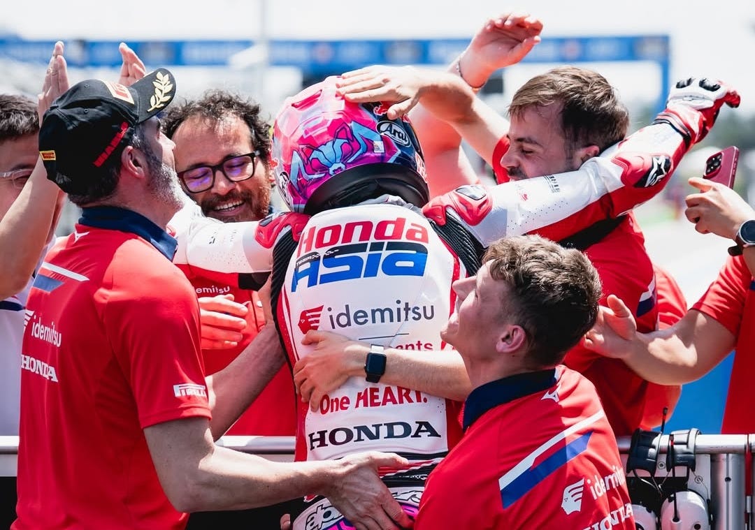 Honda Team Asia members celebrate with Veda Ega Pratama following his third-place finish at the Moto3 Brazil Grand Prix—a first career podium for the 17-year-old Indonesian. Honda Team Asia members celebrate with Veda Ega Pratama following his third-place finish at the Moto3 Brazil Grand Prix—a first career podium for the 17-year-old Indonesian.