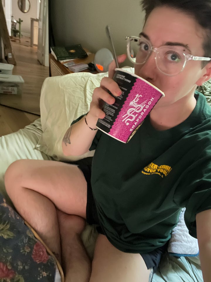 The first photo is Somer drinking orange juice in their kitchen. The next photo is Somer sipping on ramen in bed.