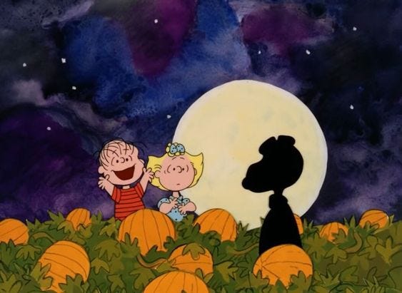 This may contain: charlie and snoop on pumpkins with the moon in the background
