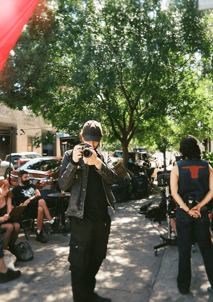 Film photos of my friend at a sushi restaurant, a brick graffitied building in Manhattan, the on-set photographer for my friend's short film, and some fans after Knicks finals game 4
