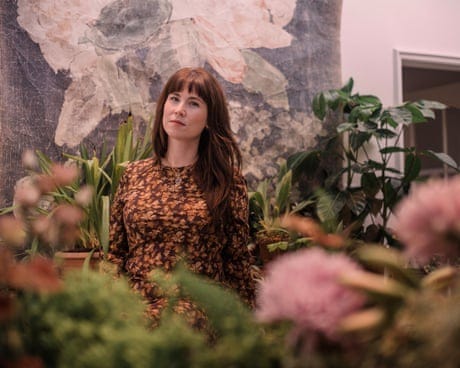 Amy Aniceto surrounded by flowers