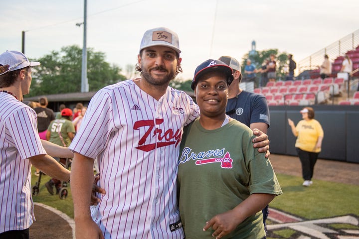 TROY student-athletes help celebrate opening night of the Miracle League with Miracle League players on Monday night at Riddle-Pace field. The Troy Miracle League in Troy, Alabama, provides children and adults of all ages with disabilities the opportunity to play baseball, and have fun. (Photos/Joey Meredith)