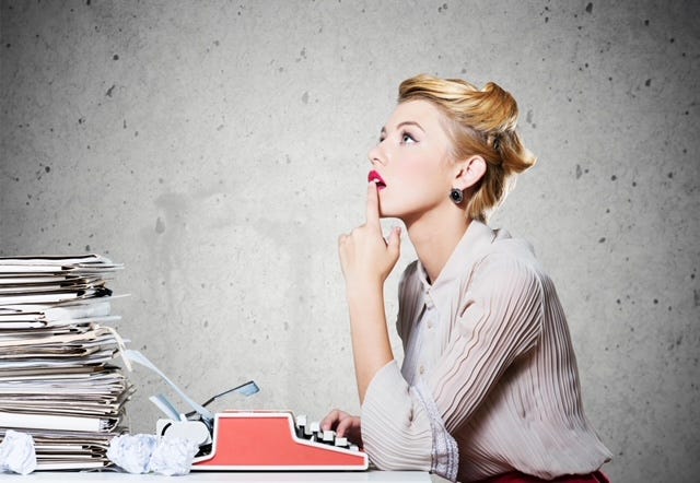 Woman writer gazing into space