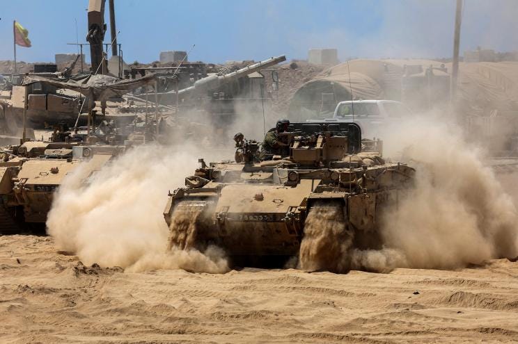 Israeli troops deploy by Israel's border fence with the Gaza Strip on July 15, 2025. Israeli troops deploy by Israel's border fence with the Gaza Strip on July 15, 2025.