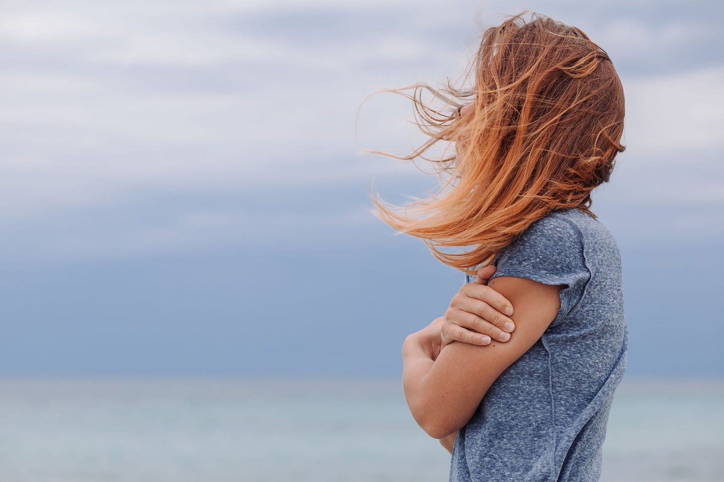 Woman looking at water.
