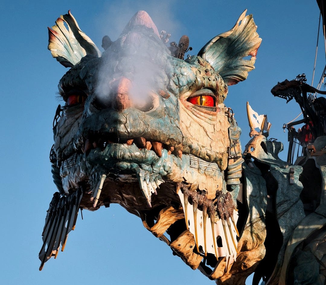 a statue of a dragon with red eyes a statue of a dragon with red eyes