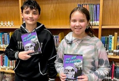 Kids holding books