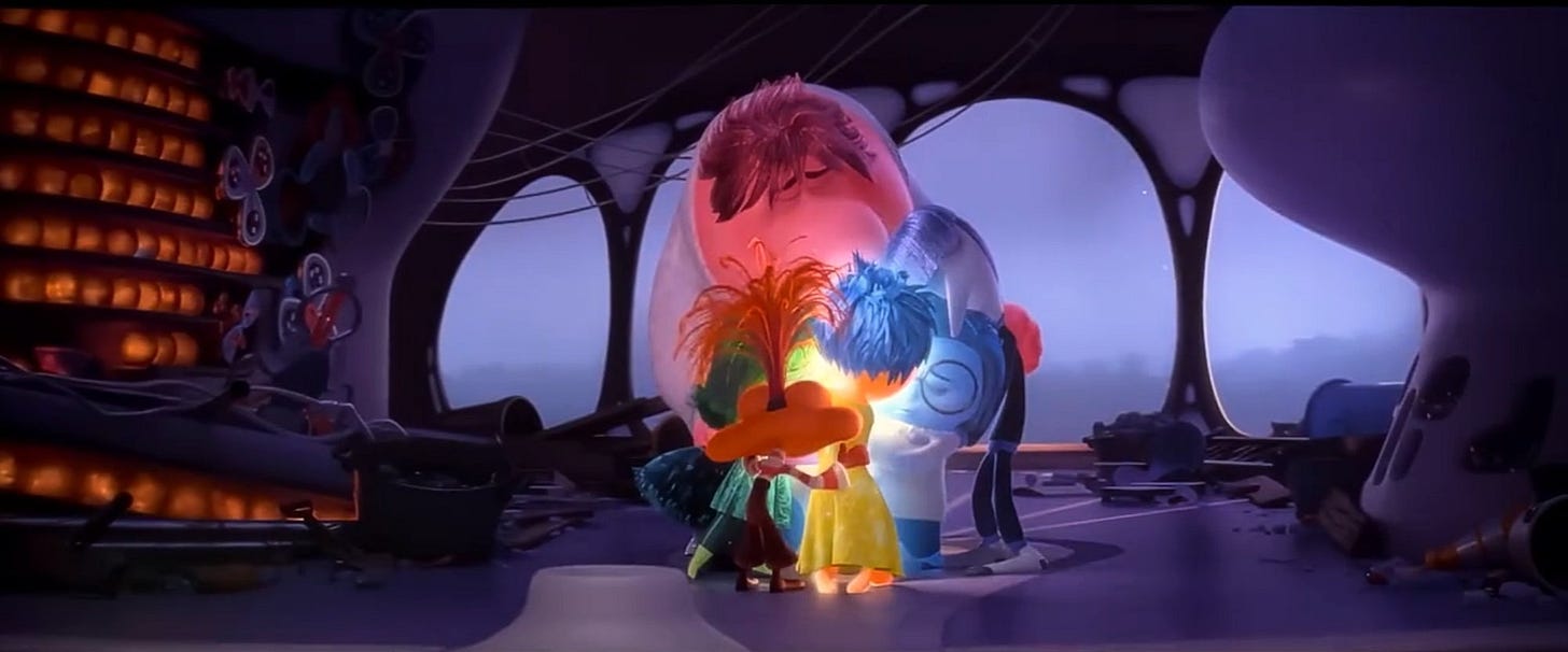 Image from Inside Out 2 movie scene where all the emotions (anxiety, embarrassment, envy, ennui, joy, sadness, fear, disgust, and anger) embrace Riley's complex sense of self.