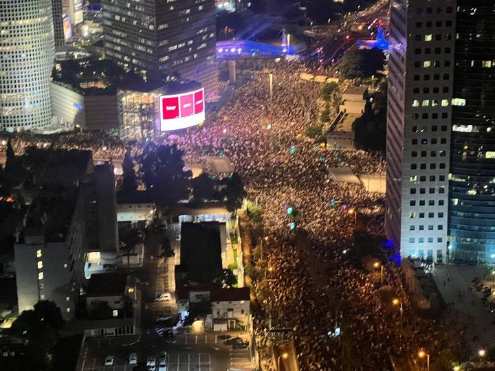 May be an image of one or more people, skyscraper, crowd and text