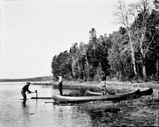 Building a canoe landing at Clifford Lake, Maine; Jack Howard, friend Leonard Small and Guide Bill in a portrait