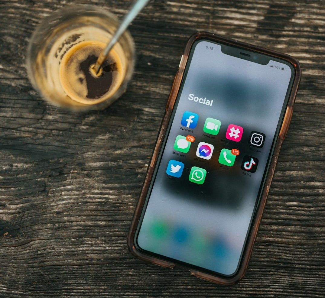 white samsung android smartphone on brown wooden table