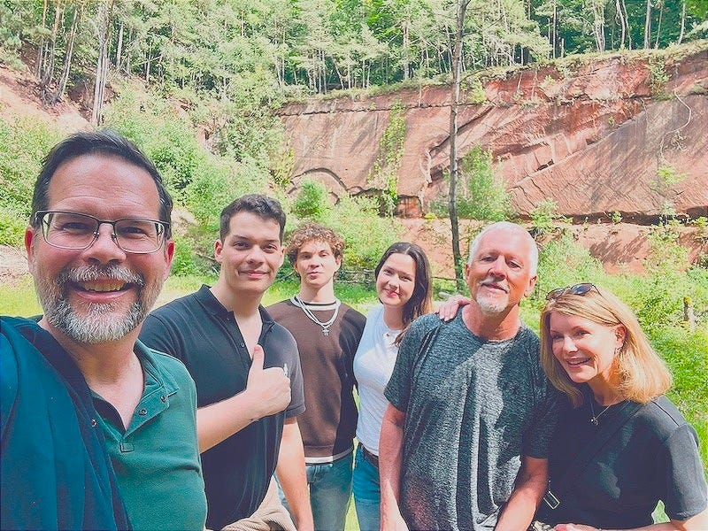 a picture of my brother, his family, me and my husband in the forest near Otterberg