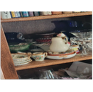 cabinet cluttered with glassware cabinet cluttered with glassware
