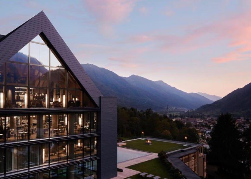 Exterior view of Lefay Resort & SPA surrounded by mountains overlooking Lake Garda
