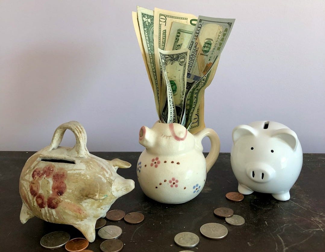 white ceramic teapot beside white ceramic teapot