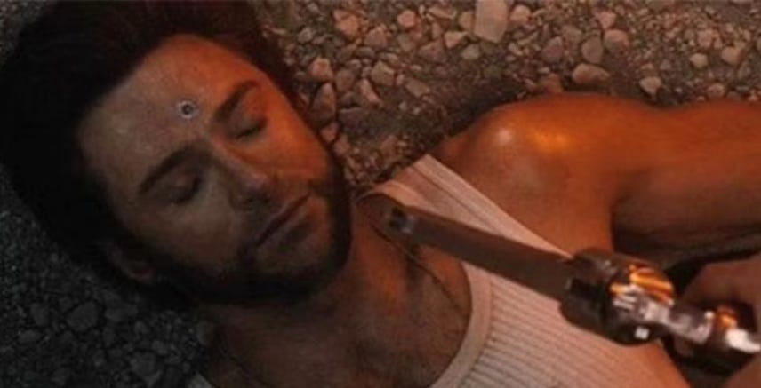 A wounded Wolverine lies on rocky ground as a gun is pointed at his head A wounded Wolverine lies on rocky ground as a gun is pointed at his head