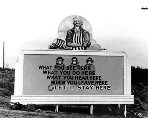 A Manhattan Project secrecy billboard at Oak Ridge, showing Uncle Sam above a warning to keep what workers see, do and hear at the site secret.