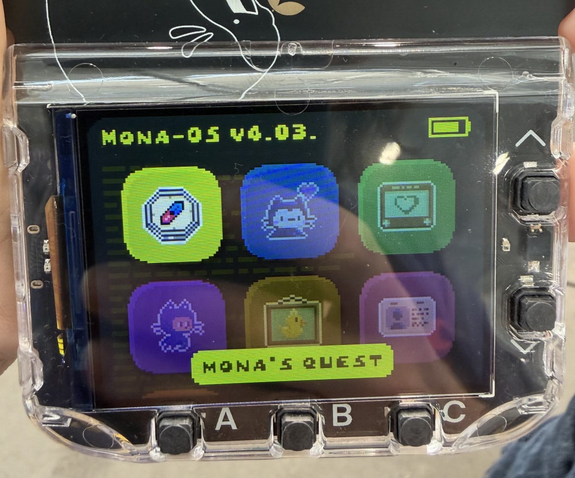 Photo of the badge - it has a color screen with six app icons Photo of the badge - it has a color screen with six app icons