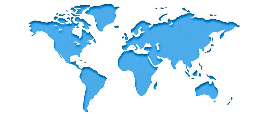 World map cut out of paper over blue background