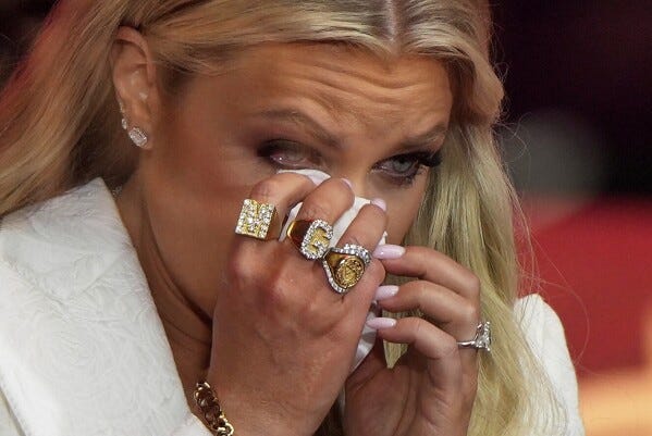 Erika Kirk wipes tears as she prepares to speak at a memorial for her husband, conservative activist Charlie Kirk, Sunday, Sept. 21, 2025, at State Farm Stadium in Glendale, Ariz. (AP Photo/Julia Demaree Nikhinson)