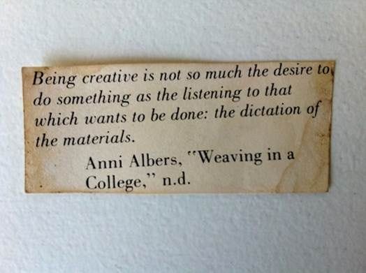 This may contain: an old paper sign that reads being creative is not much the desired to do something as the listening to that which wants to be done