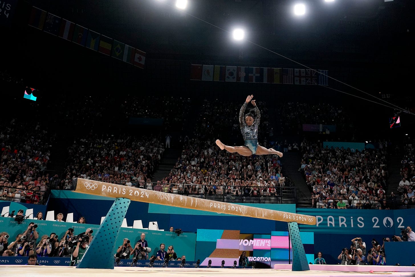 US gymnast Simone Biles competes on the balance beam during the Olympic qualification round on July 28. <a href="https://www.cnn.com/2024/07/28/sport/simone-biles-return-paris-olympics-2024-spt-intl/index.html">She landed awkwardly</a> while warming up for her floor routine, but <a href="https://www.cnn.com/2024/07/28/sport/simone-biles-return-paris-olympics-2024-spt-intl/index.html">she fought through the pain</a> to post an impressive all-around score.