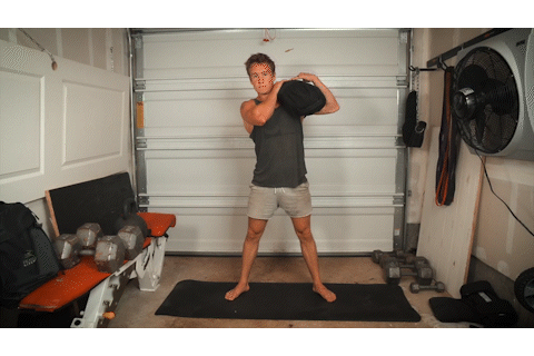 Brian demonstrates sandbag shouldering in his garage. Brian demonstrates sandbag shouldering in his garage.