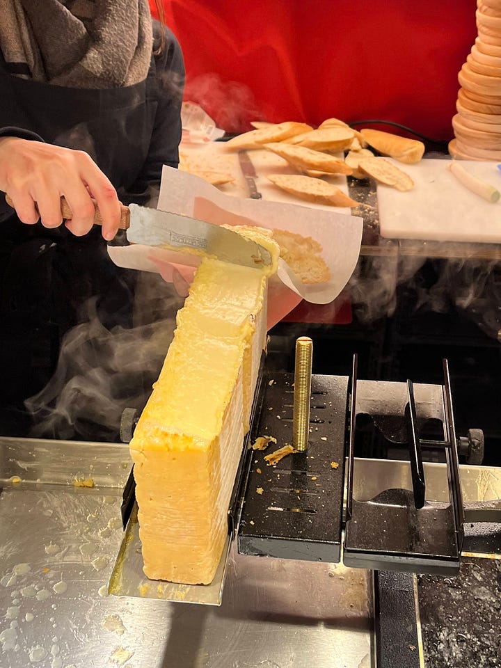 Raclette cheese and a crowded market