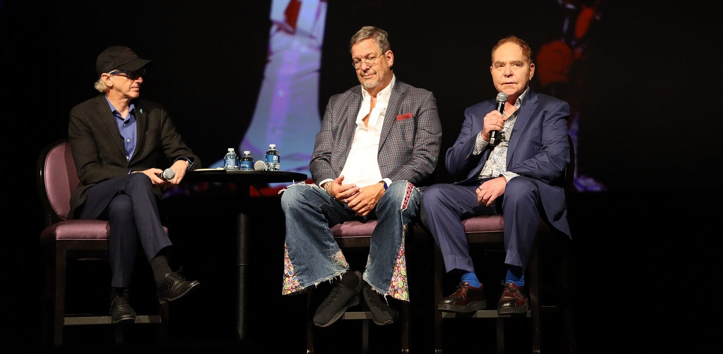 May be an image of 3 people and text