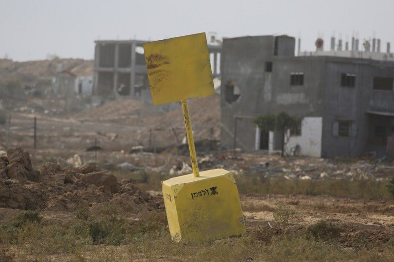 A concrete block marks the "Yellow Line" drawn by the Israeli military in Bureij, in the central Gaza Strip, on Nov. 4. A concrete block marks the "Yellow Line" drawn by the Israeli military in Bureij, in the central Gaza Strip, on Nov. 4.