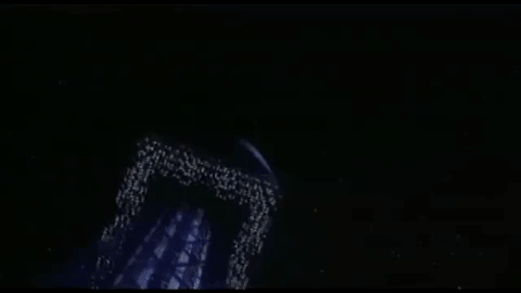 The weight shaped scaffolding space station is shooting off into the darkness.