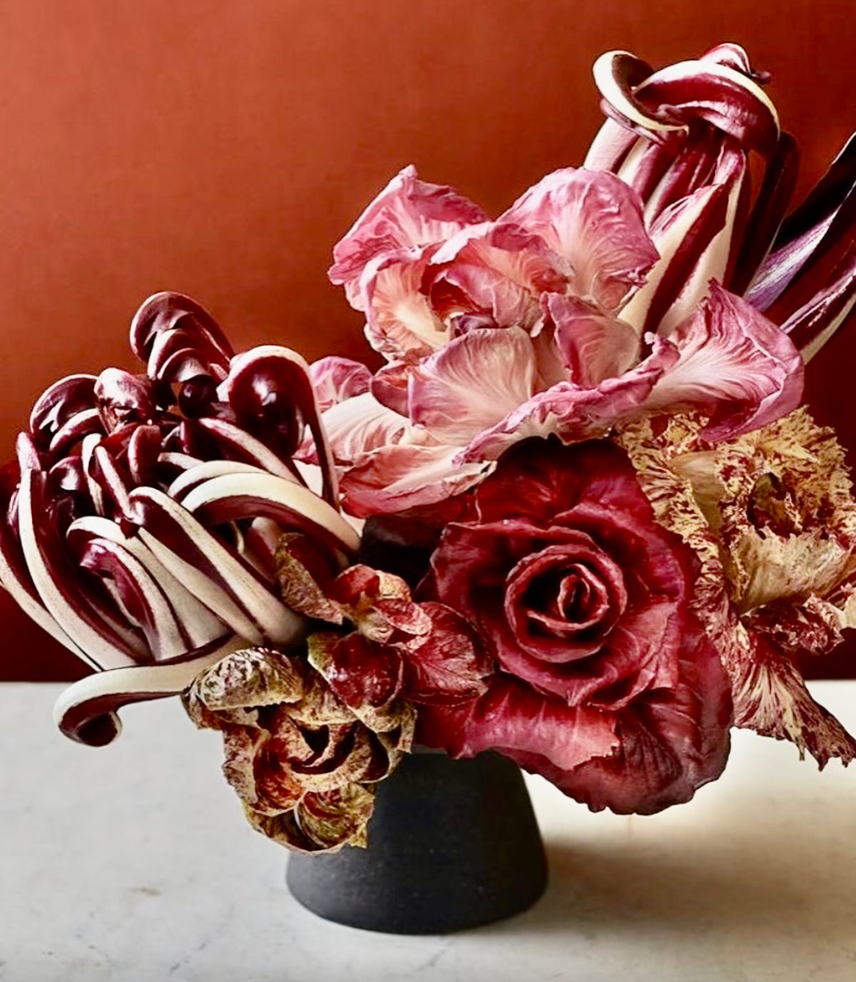lettuces and radicchio in a jug