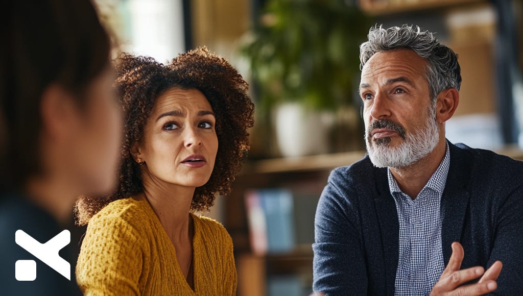 a woman and a man frustrated in an office discussion