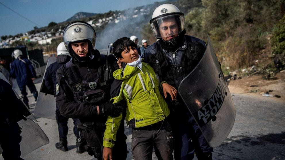 PHOTO: Riot police detain a migrant during clashes near the Moria camp for refugees and migrants, on the island of Lesbos, March 2, 2020. PHOTO: Riot police detain a migrant during clashes near the Moria camp for refugees and migrants, on the island of Lesbos, March 2, 2020.