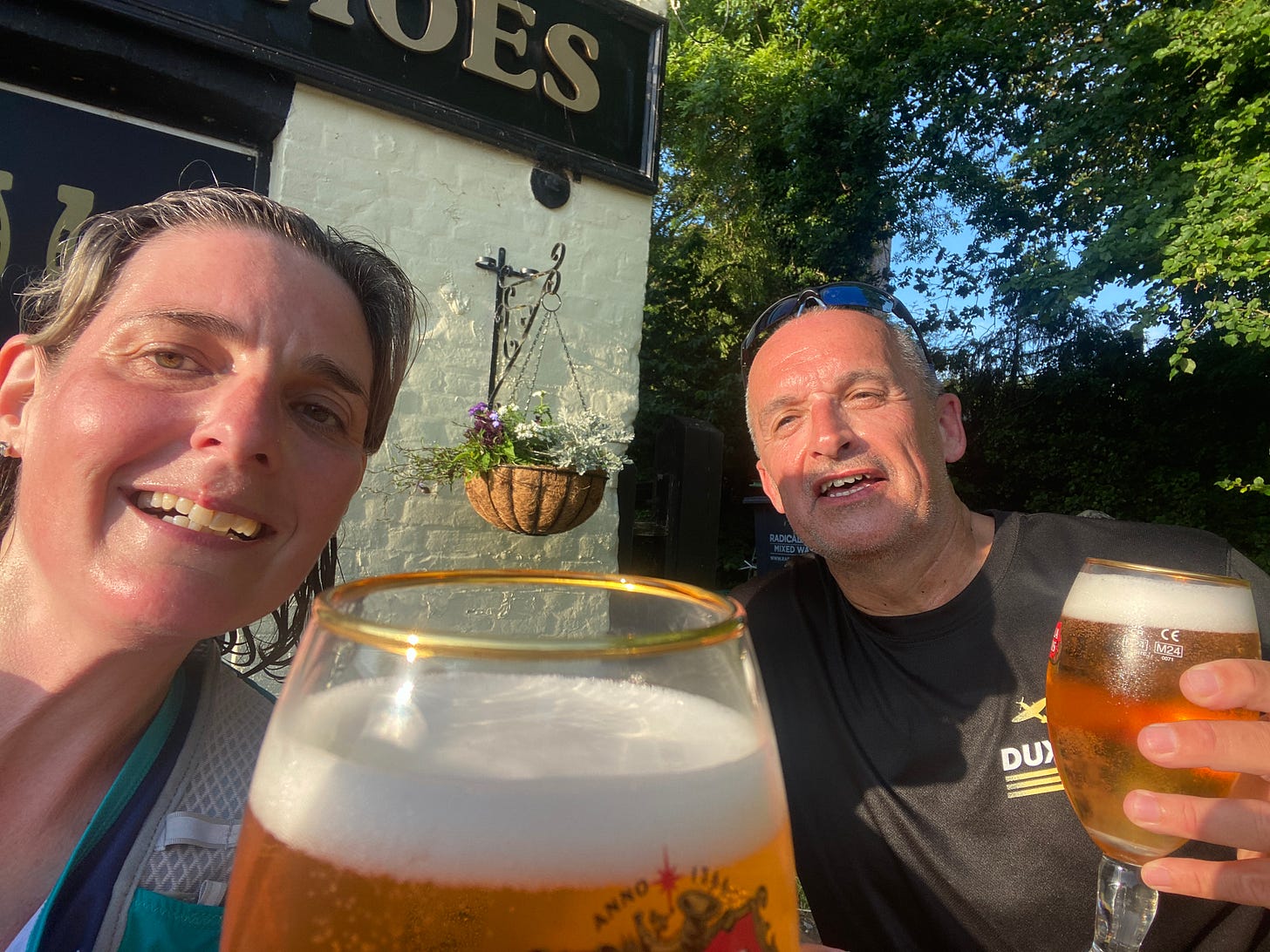 two runners with a cold pint after a hot run