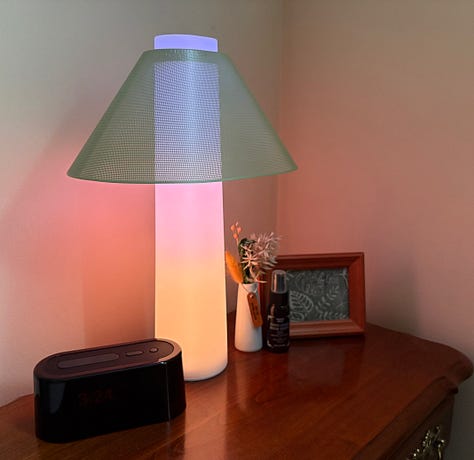 Three photos depicting an at-home workout, the book Meet Me Tonight in Atlantic City, and the author's nightstand with an alarm clock and lamp.