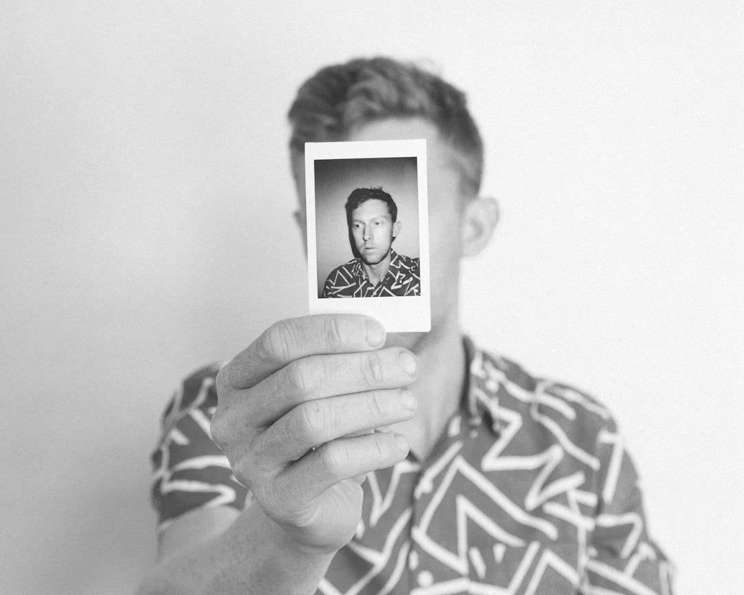 man showing photo of him