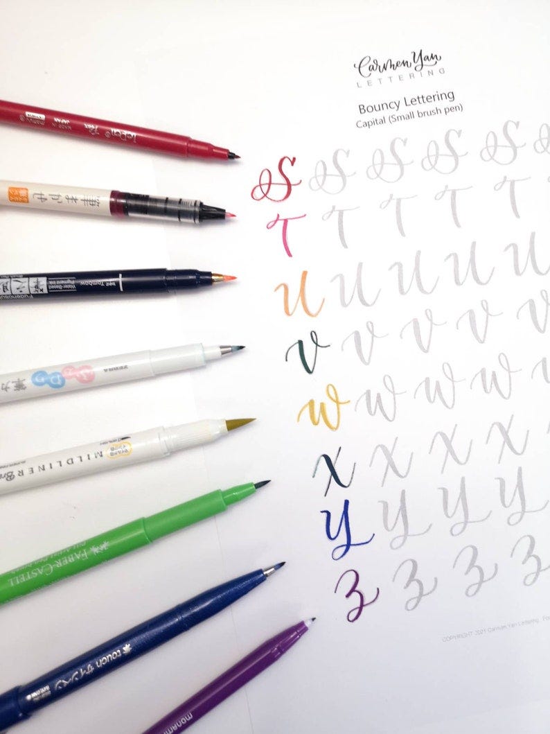 May include: A white sheet of paper with gray lettering showing how to write the letters S, T, U, V, W, X, Y, and Z in a bouncy style.  The letters are written in different colors using brush pens.  The text at the top of the page reads "Bouncy Lettering Capital (Small brush pen)"
