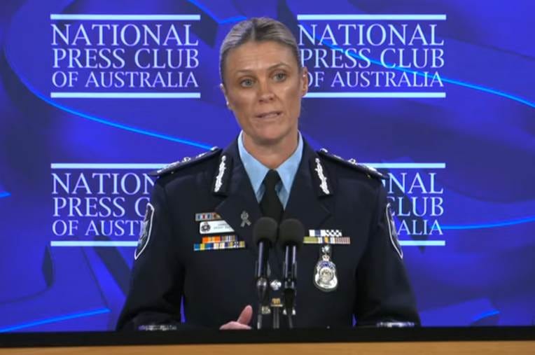 A person in a uniform at a podium

AI-generated content may be incorrect.