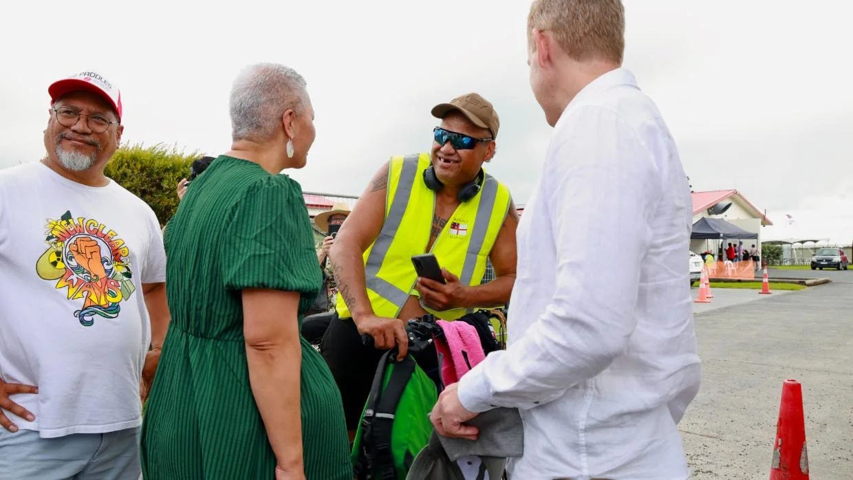 Green co-leader Marama Davidson and Labour leader Chris Hipkins in Waitangi, chatting with Brian. Photo: Ricky Wilson / Stuff.
