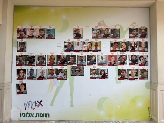 A wall with pictures of people on it

AI-generated content may be incorrect.