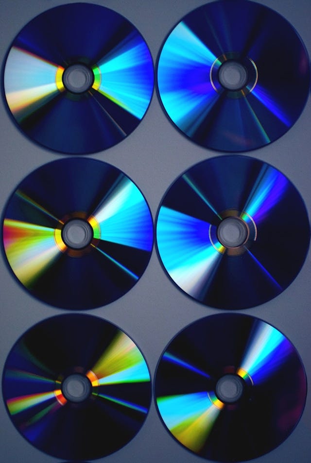 CDs against a gray background. CDs against a gray background.